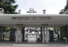 Ippodromo Snai San Siro: sabato 25 aprile con sette corse, spicca il Gran Premio Barbetta Entrance to Ippodromo Del Trotto featuring a horse-logo sign above stone columns and gates