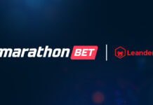 Casino online: Marathonbet.it sigla una nuova partnership con Leander Games Marathon Bet and Leander logos shown side by side with a vertical divider on a dark blue gradient background, representing a partnership or collaboration.
