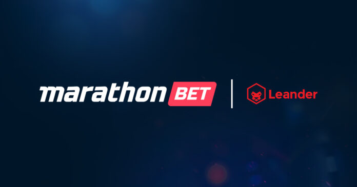 Leander marathonbet Marathon Bet and Leander logos shown side by side with a vertical divider on a dark blue gradient background, representing a partnership or collaboration.