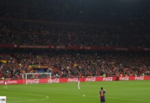 Scommesse Liga: su Betflag vittoria del Barcellona in casa del Getafe a 1.63 Full stadium filled with spectators watching a soccer match, red banners along the stands and Coca‑Cola ads around the pitch.