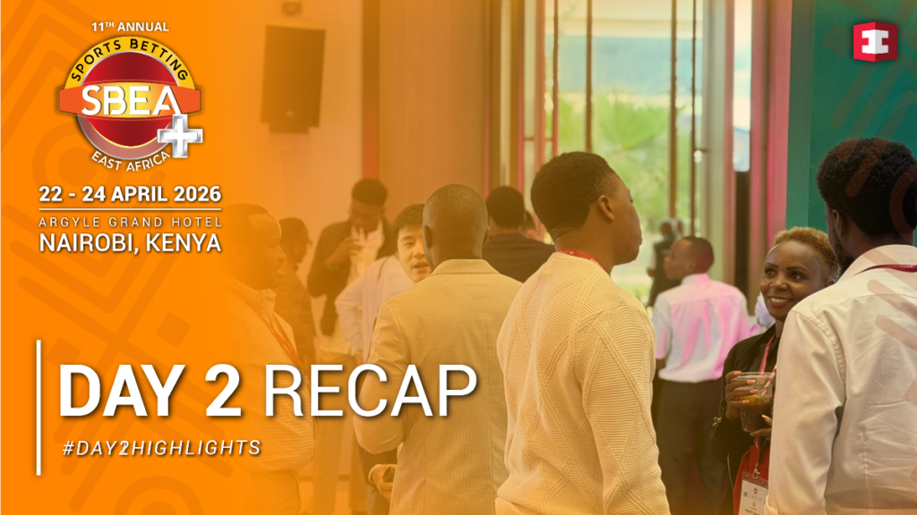 Conference attendees network in a lobby beside an orange left banner that says Day 2 Recap and Nairobi, Kenya 2026 SBEA event logo