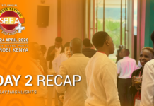Gioco online: SBEA+ Summit 2026, seconda giornata a Nairobi nel segno di regolazione e crescita sostenibile Conference attendees network in a lobby beside an orange left banner that says Day 2 Recap and Nairobi, Kenya 2026 SBEA event logo