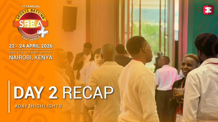 SBEA+ Summit 2026 day 2 Conference attendees network in a lobby beside an orange left banner that says Day 2 Recap and Nairobi, Kenya 2026 SBEA event logo
