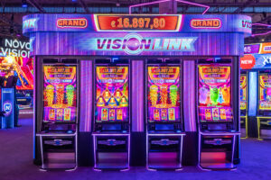 Row of glowing slot machines with colorful reels and neon purple lighting in a casino setting.