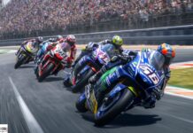 Scommesse MotoGp: per Quigioco Bezzecchi e Martin appaiati al Mugello a 2.50 Group of motorcycle racers leaning into a curve on a crowded racing track, mid-competition.