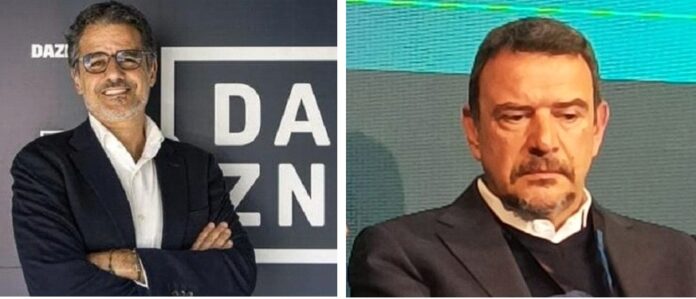 Azzi Faelli Two men in business attire shown side by side: left man with glasses and crossed arms in front of a DAZN backdrop; right man in a suit looking down at a conference scene.